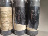 three bottles of wine sitting next to each other on a table