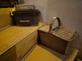 a wicker basket sitting on a set of stairs