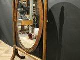 an image of a mirror on a stand in a room