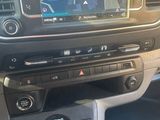 the dashboard of a car with a gps device in the center