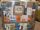 a metal cart with many items in it in a warehouse