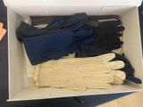 a box with gloves and gloves in it on a table