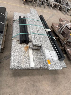 a lot of different types of granite slabs on the ground