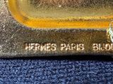 a close up of a gold bar with a ring on it