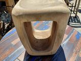 a wooden chair sitting on top of a wooden table