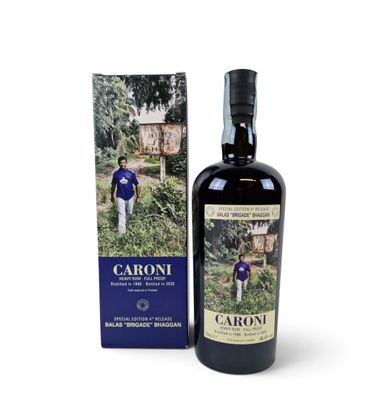 a bottle of caroni extra virgin olive oil next to a box