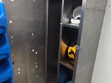 an image of a metal locker with blue bins