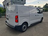 a picture of a white van parked in a parking lot