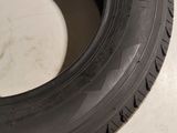 a close up of a tire on a white surface