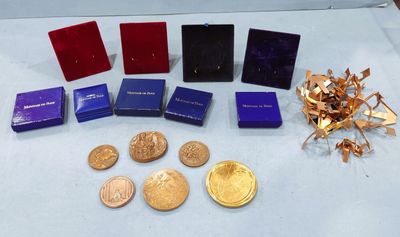 a lot of gold and silver coins on a table