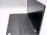 a black laptop with a black keyboard on a white surface