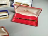 a box with a pen in it sitting on a table