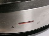 a close up view of a stainless steel plate on a stove top