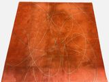 an orange rug with a design of circles and lines on it