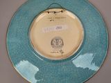 a blue and white plate with a picture of a bird on it