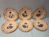 six plates with a picture of a man and a woman on them
