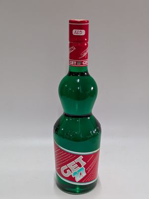 a bottle of soda that is sitting on a table