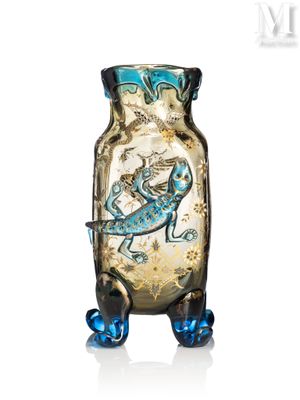 a glass vase with a lizard on it on a white surface