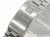 an image of a close up of a watch on a white surface