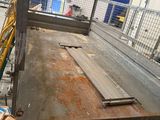 a man that is standing in a factory with a machine