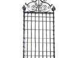 a wrought iron gate with a cross on top