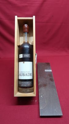 an old bottle of rum in a wooden box next to a knife