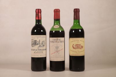 trois bouteilles de vin posées l'une à côté de l'autre sur une table