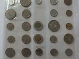 a lot of coins in a plastic bag on a table