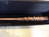 a wooden baseball bat in a black box on a table
