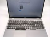an open laptop computer sitting on top of a white table