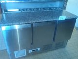 a stainless steel counter top with a microwave on it