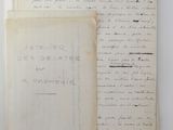 two old papers with writing on them sitting on a table