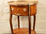 a small table with a drawer on top of it