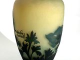a vase that has a picture of a bird on it