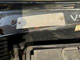 a close up of a car engine with the hood open