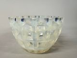 a glass bowl that is sitting on a table