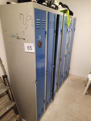 several lockers are lined up in a row in a room
