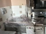 an image of a kitchen with a lot of appliances in it