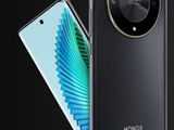 a black phone with a circular camera on the back of it