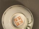 a small bowl with a design on it on a table
