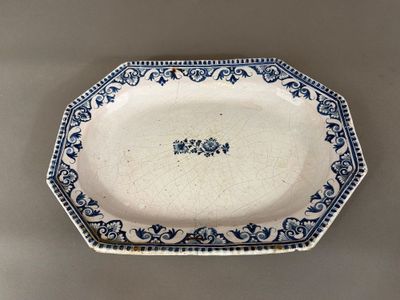 a close up of a blue and white plate on a table