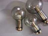 three light bulbs that are sitting on a table