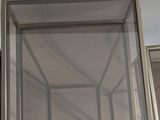 a picture of a glass display case on the wall