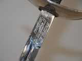 a close up of a knife on a table