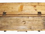an old wooden box with a handle on it