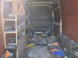 an image of a van with a ladder in the back of it