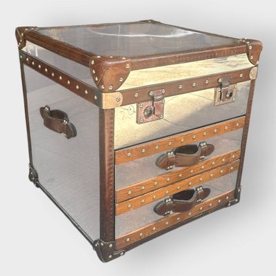a small chest with three drawers on top of it
