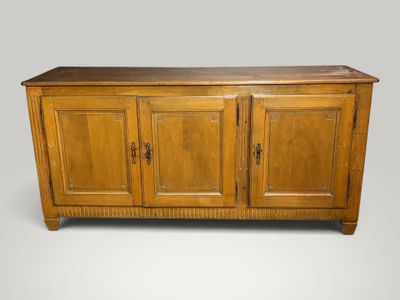 an antique oak sideboard with three doors and two drawers