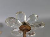 a glass flower that is on top of a stick