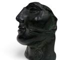 sculpture of a man ' s head on a white background